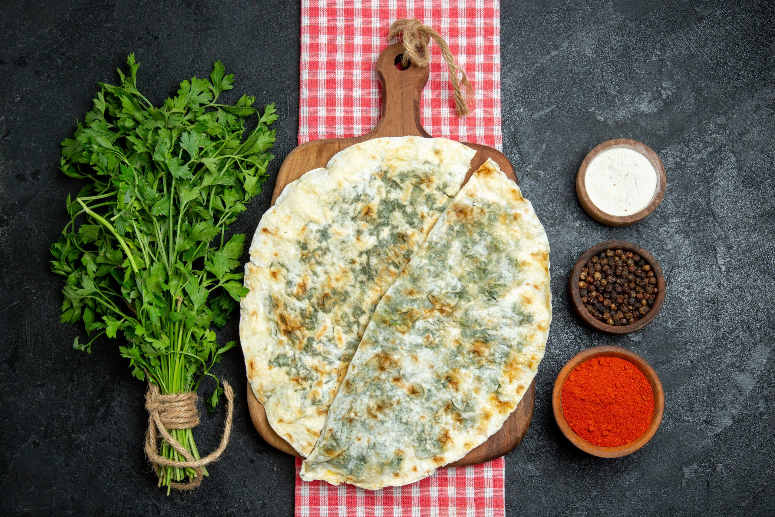 top-view-delicious-qutabs-cooked-dough-slices-with-different-seasonings-grey-space (1)